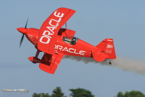 Sean Tucker tumbling over his Oracle Challenger III