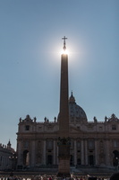 Sun lighting up the obelisk on Place Saint Peter